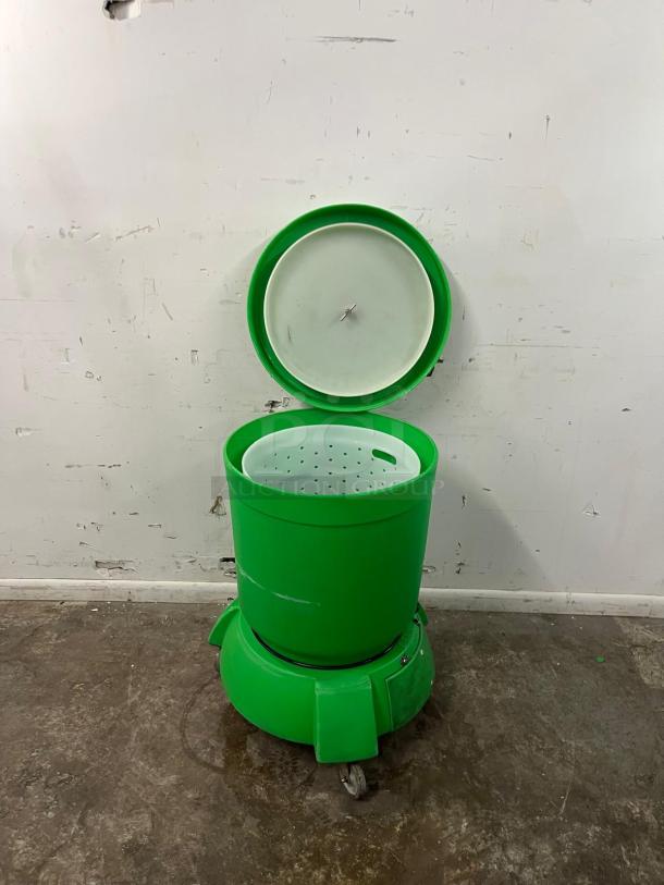 Electrolux VP-3 "The Greens Machine" commercial vegetable spinner; green, with built-in water reservoir and drain; used condition.