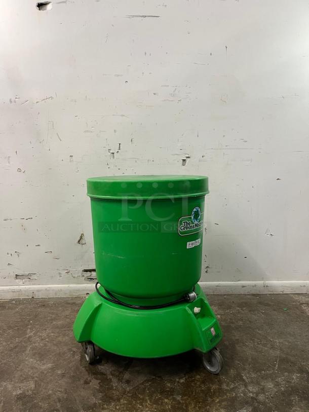 Electrolux VP-3 "The Greens Machine" commercial vegetable spinner, green, with built-in reservoir and drain, on wheels.