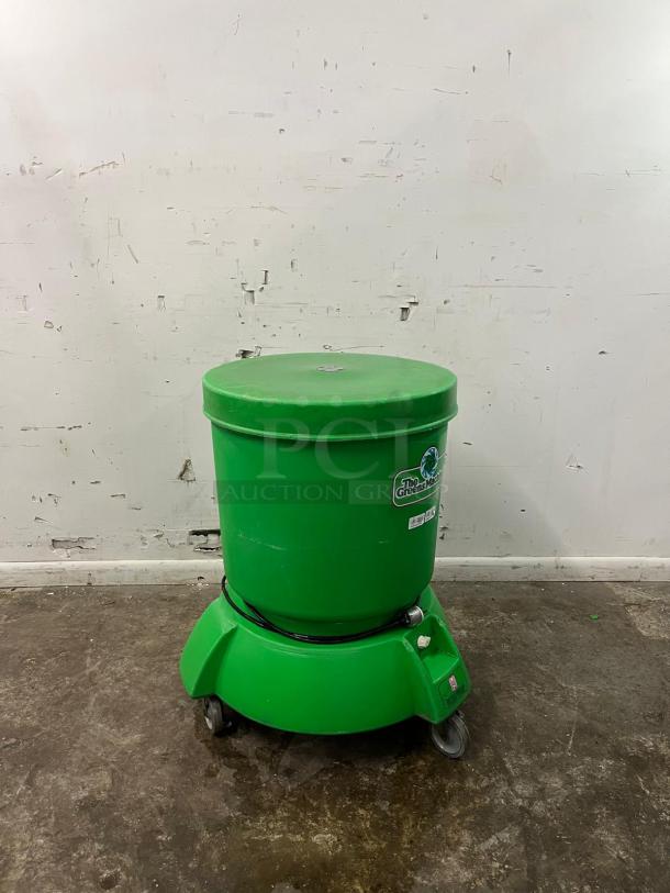 Electrolux VP-3 "The Greens Machine" commercial vegetable and salad spinner in green, with built-in water reservoir and drain system.
