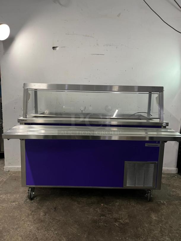 Delfield SCSC-60-EFP 60" refrigerated food counter; stainless steel, with glass cover and drain; mounted on casters.