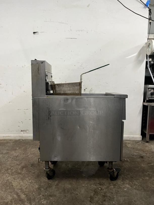 PITCO SG14-S gas fryer, 50 lb vat, floor model, natural gas, visible wear, with fryer basket.