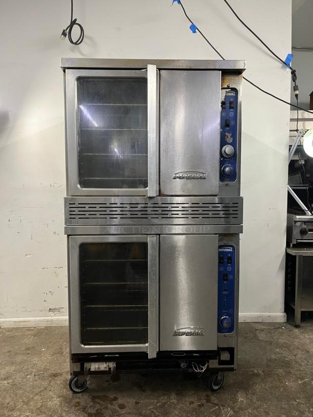 Double-deck Imperial convection oven, stainless steel, glass doors, control knobs, on wheels, commercial grade.