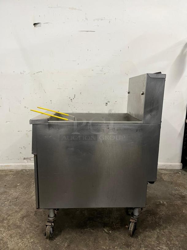 PITCO SG14-S gas fryer, floor model, 40-50 lb. capacity, 110,000 BTU, natural gas, used condition, on wheels.