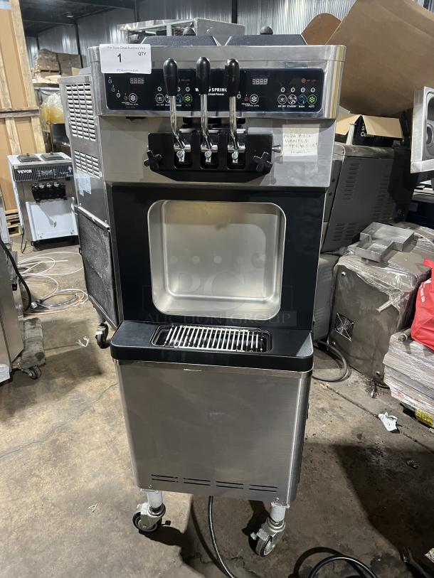 Well Spring SSI143S stainless steel soft serve machine, twin/twist, 2 hoppers, 3 dispensers, drip tray, digital controls, on casters.