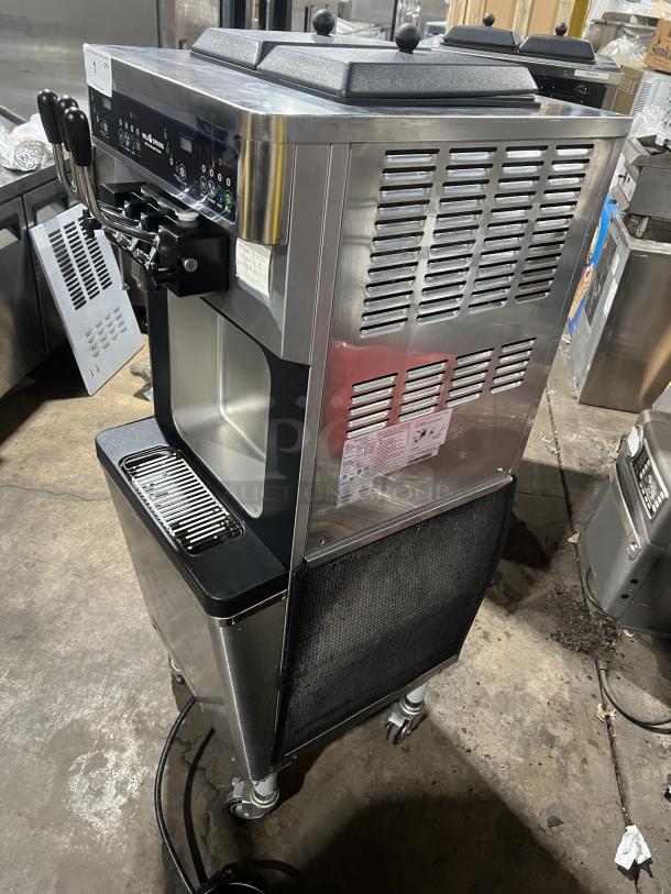 Well Spring SSI143S stainless steel ice cream machine with twin hoppers, three dispensers, digital controls, and drip tray.