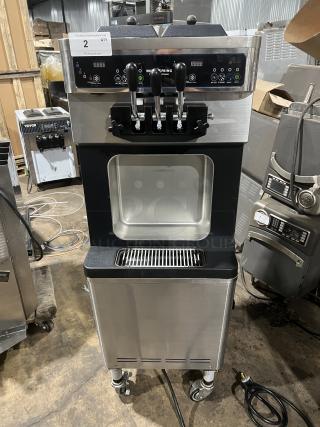 Well Spring SSI-143S stainless steel soft serve machine with two hoppers, three dispensers, digital controls, and drip tray.