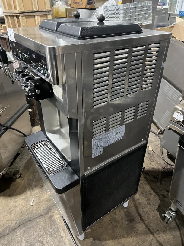 Well Spring SSI-143S stainless steel ice cream machine with 2 hoppers, 3 dispensers, drip tray, digital controls, on casters.