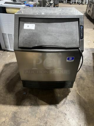 Manitowoc NEO Series undercounter ice machine UY0140A161B, stainless steel, air-cooled, on casters, 115V, model info visible.