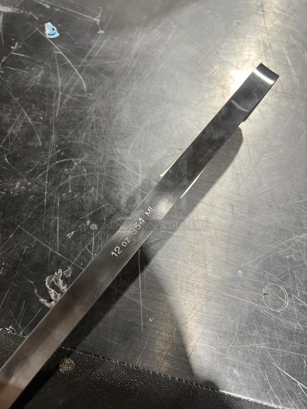NEW Adcraft stainless steel 12 oz ladle, model LD12. Etched marking: "12 oz 354 ml." Ideal for commercial use.