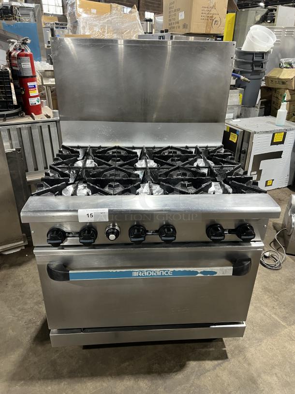 Turbo Air Radiance Series 6 Burner Range/Oven Combo, stainless steel, natural gas, with backsplash and wired oven rack, on casters.