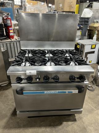 Turbo Air Radiance Series 6 Burner Range/Oven Combo, stainless steel, natural gas, with backsplash and wired oven rack, on casters.