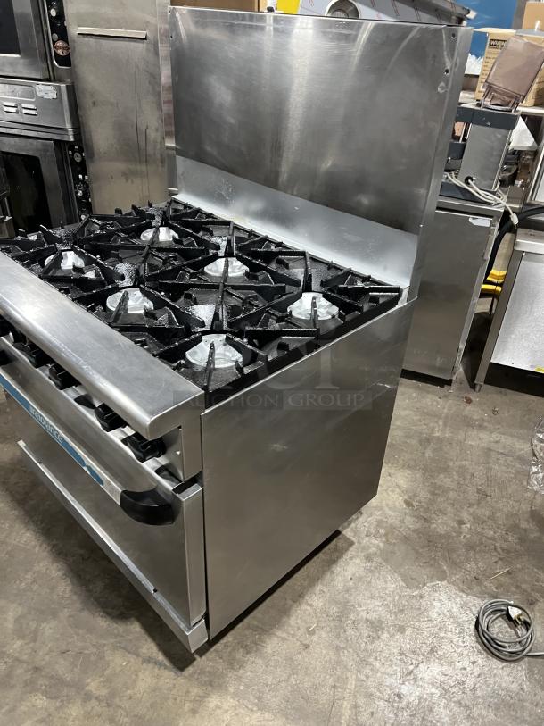 Turbo Air Radiance Series 6 burner stainless steel range/oven combo, natural gas, with wired oven rack, backsplash, on casters.