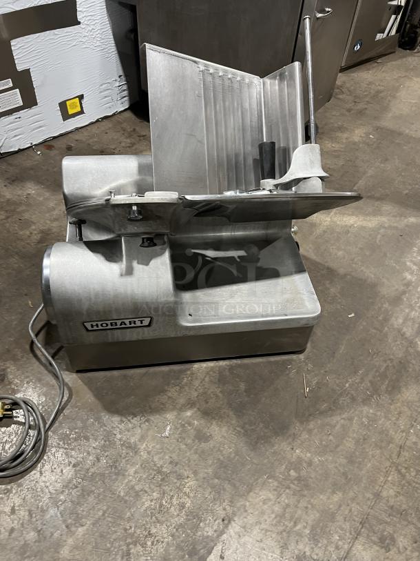 Hobart Commercial Stainless Steel Meat Slicer, Model 1712, electric, countertop, on legs, good condition, 115V 1Phase.