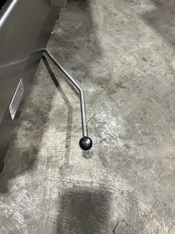 Hobart 1712 stainless steel countertop deli meat slicer leg, 115V, electric-powered, appears durable, in good condition.