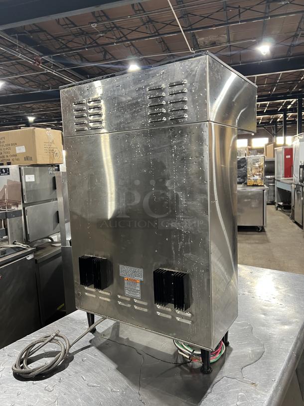 Bunn ThermoFresh Series Dual Coffee Brewer, stainless steel, Model DUALTFDBC, with hot water dispenser, 120/208V, on legs.