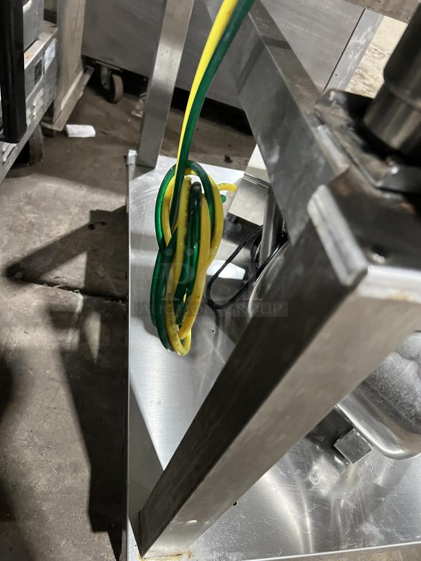 Close-up of Angelopo Combi Oven Model FX61G3UKX02 showing stainless steel structure and electrical wiring details.