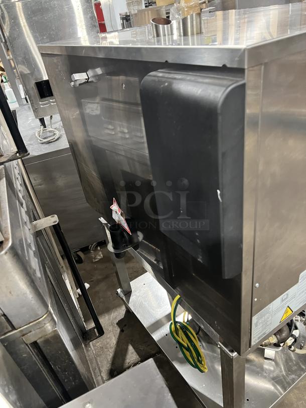 Angelopo stainless steel gas combi oven, model FX61G3UKX02, on legs, with wired oven racks, and control touch display.