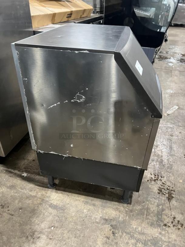 Manitowoc stainless steel undercounter ice machine, electric, with bin, on legs, visible wear, SN: 310466826.