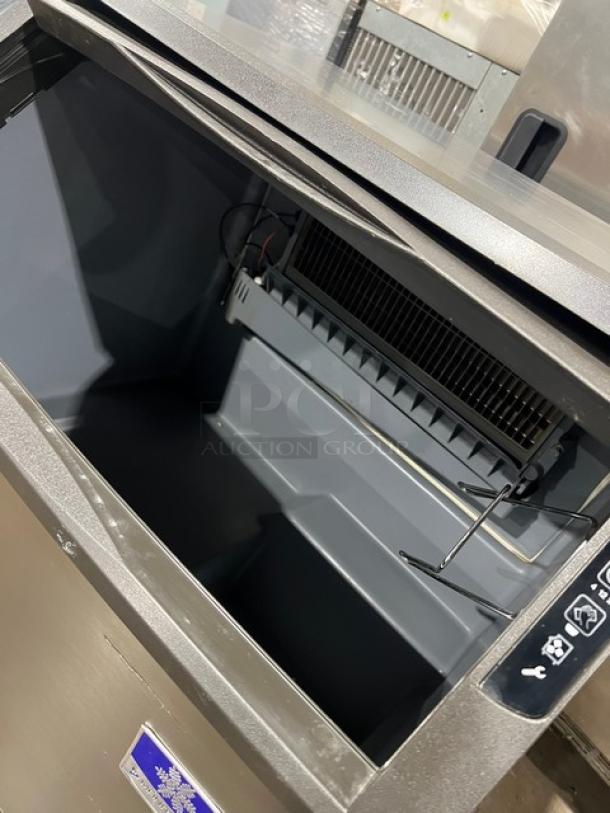 Manitowoc stainless steel undercounter ice making machine, electric, 115V, 1 phase, on legs. SN: 310466826.