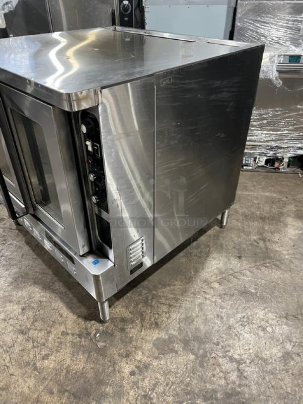 Blodgett stainless steel electric convection oven, single stacked, with wired rack, on legs, in good condition.