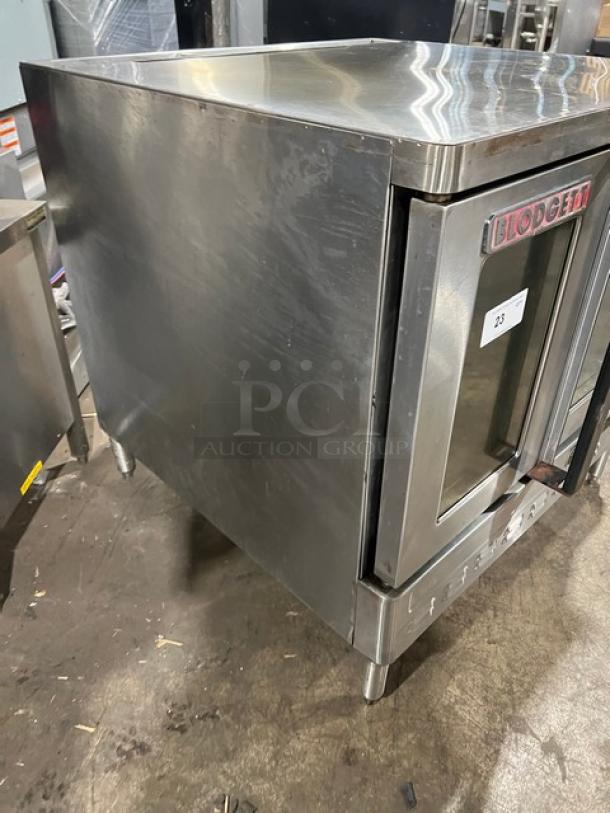 Blodgett commercial stainless steel electric convection oven with wired rack, single stacked, on legs, visible logo.