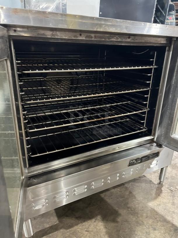 Blodgett stainless steel single stack convection oven with wired racks, on legs. Electric powered. Clean, good condition.