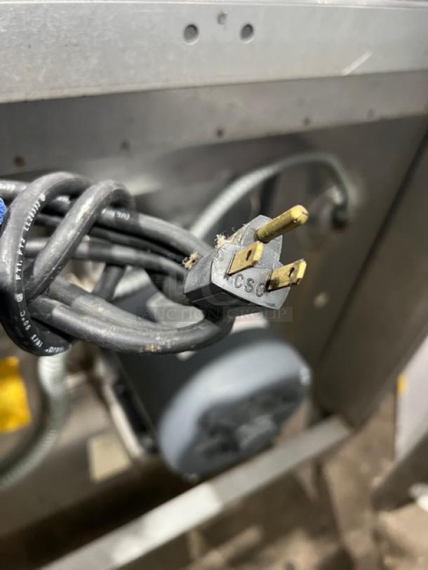 Blodgett commercial stainless steel electric convection oven with wired rack and legs, plug shown, in used condition.