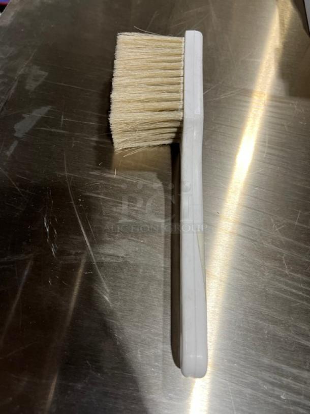 New commercial white utility pot scrub brush with sturdy bristles and long handle, ideal for cleaning tasks.