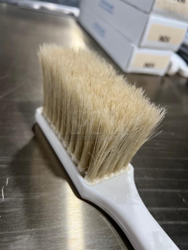 New commercial white utility pot scrub brush with firm bristles and ergonomic handle. Ideal for heavy-duty cleaning tasks.