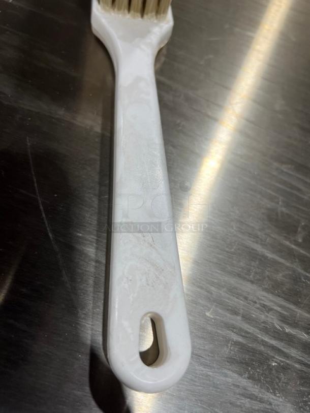 New commercial white utility/pot scrub brush, ergonomic handle, durable bristles, ideal for heavy-duty cleaning tasks.