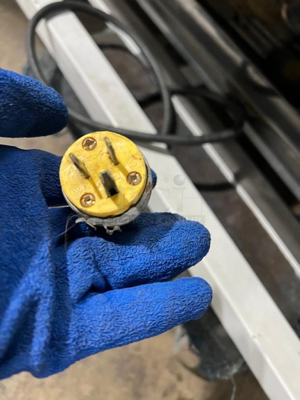 Plug for IRS Orchid76SL1800 refrigerated display case. Yellow, three-prong design with visible screw connectors.