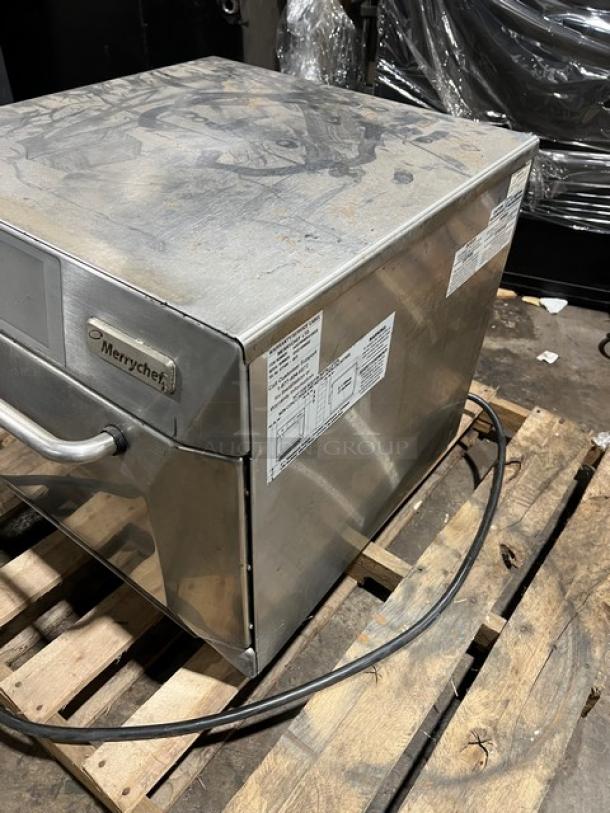 Late model Merrychef eikone4s stainless steel rapid cook convection oven with digital touch controls, visible model and power labels.