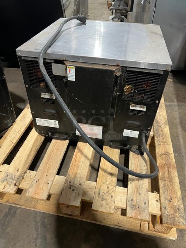2011 Amana AXP20 countertop rapid cook oven, stainless steel, electric-powered, includes wired oven racks, visible serial number 1106101609.