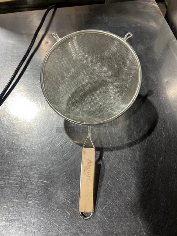 Adcraft stainless steel strainer with wooden grip handle, brand new. Features fine mesh and durable construction.