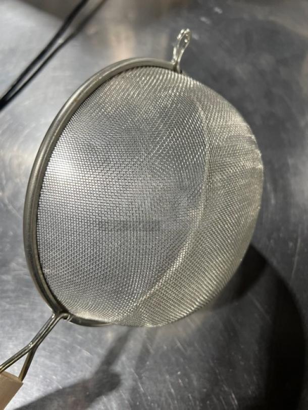 Adcraft commercial stainless steel strainer with wooden grip handle, new condition. Ideal for heavy-duty kitchen use.