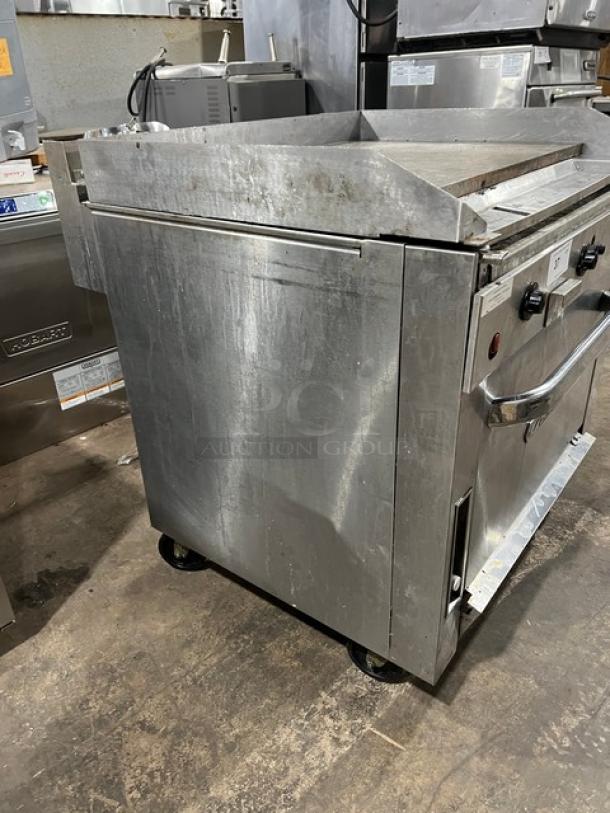 Southbend P36ATTT stainless steel flat-griddle top range and oven combo on casters, natural gas, with wired racks, used condition.