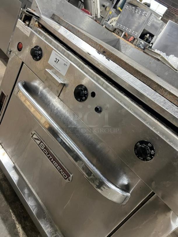 Southbend P36ATTT commercial stainless steel griddle and oven combo, natural gas, with wired oven racks, on casters.