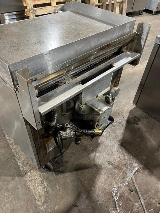 Southbend stainless steel flat-griddle top range and oven combo, Model P36A-TTT. Natural gas, on casters, with wired oven racks.