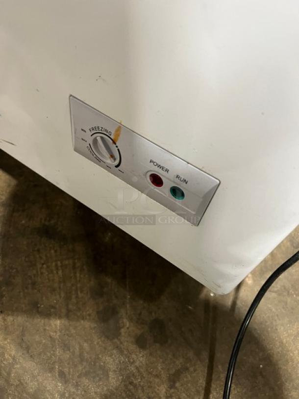 KoolMore SCF20C chest freezer control panel showing power and run indicators, slight discoloration visible.