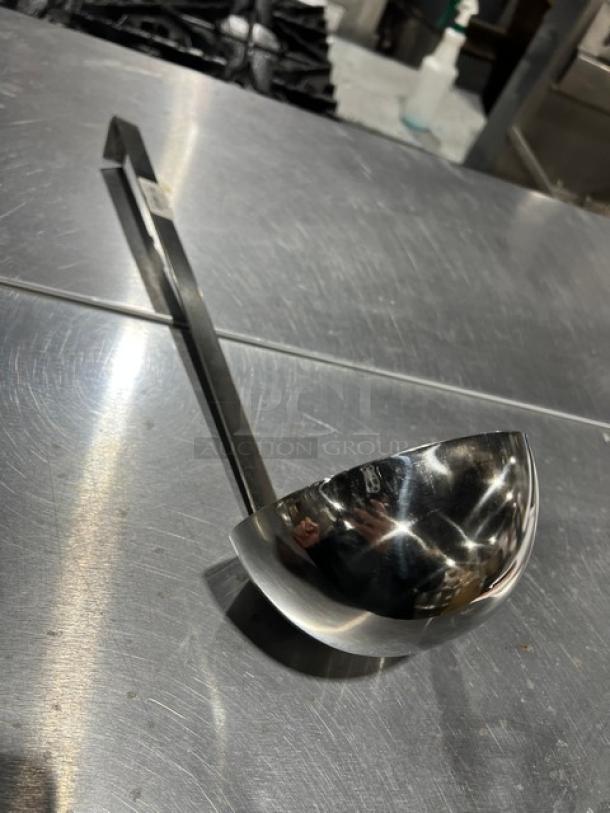 Adcraft LAD24 stainless steel 24 oz. serving ladle in excellent condition; features a long handle for easy serving.