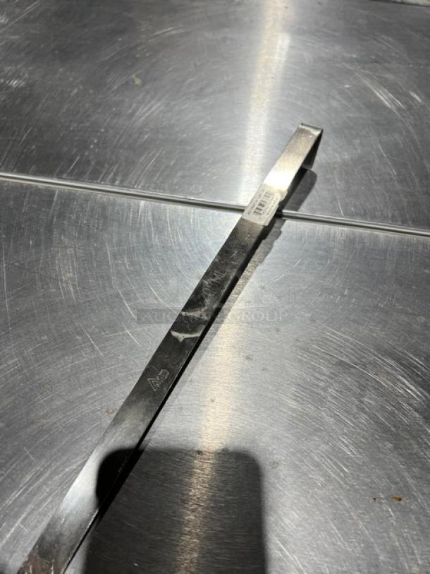 Adcraft stainless steel serving ladle, Model LAD24, 24 oz. capacity. Features durable construction. Appears in good condition.