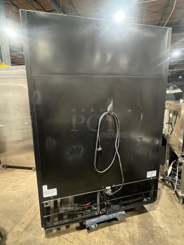 True GDM-49-HC~TSL01 commercial black double glass door refrigerator, Energy Star certified, poly coated racks. Back view.
