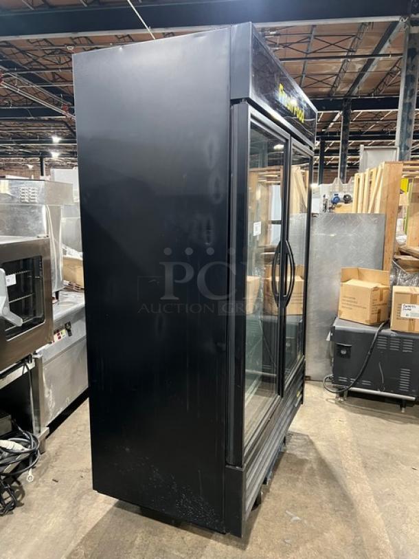 True GDM-49-HC~TSL01 black double glass door merchandiser fridge, poly-coated racks, Energy Star, good condition.