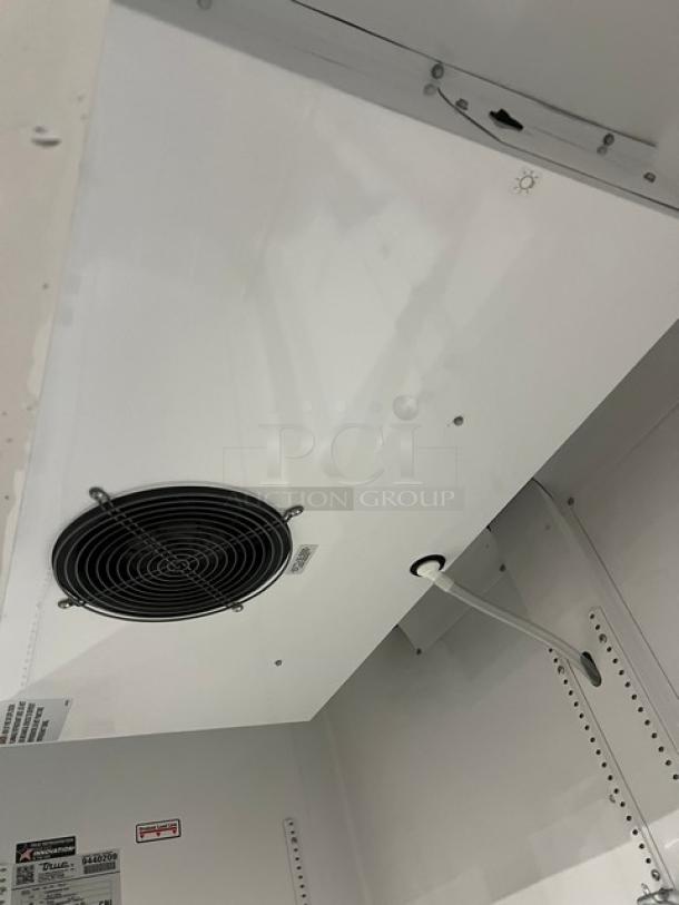 True GDM-49-HC~TSL01 merchandiser interior view; poly-coated racks, energy-efficient fan. Model label visible. 115V, 1 phase.