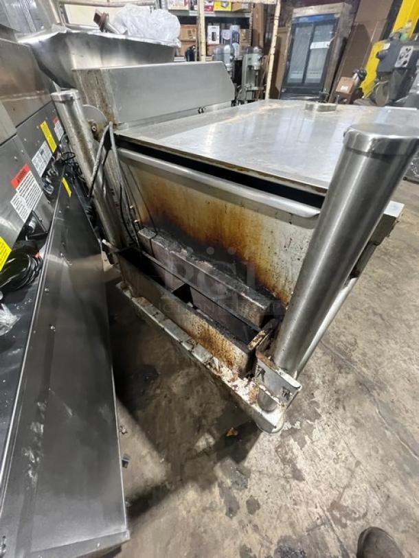 Cleveland stainless steel natural gas tilt skillet, open base, 115V, 1 phase, commercial use, visible wear and discoloration.