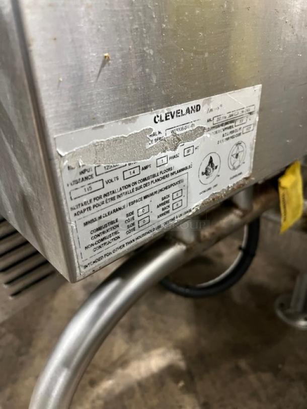 Cleveland stainless steel natural gas tilt skillet, open base, 115V, 1 phase. Visible wear on label.