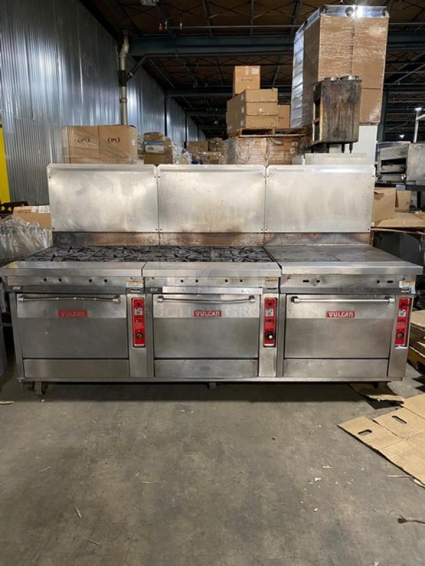 Vulcan stainless steel gas 8-burner split-top flat griddle range with triple oven combo, backsplash, and casters. Includes wired oven rack.