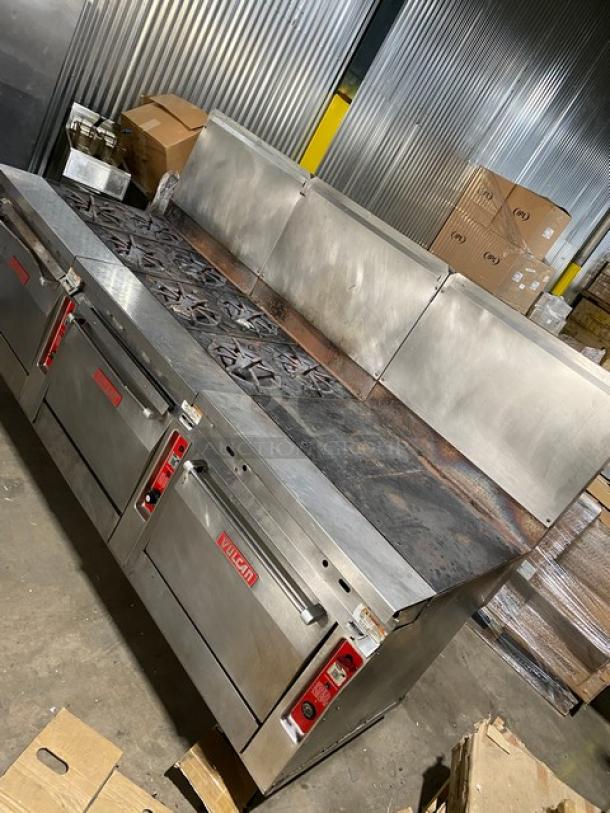 Vulcan commercial stainless steel gas-powered 8-burner range with split-top flat griddle, triple oven combo, and backsplash.