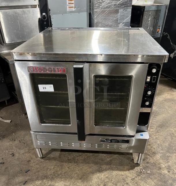 Blodgett commercial stainless steel electric convection oven, single-stacked, wired rack, on legs, clean, with controls.