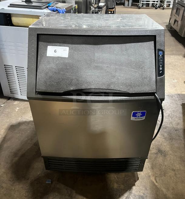 Manitowoc NEO Series undercounter ice machine UY0140A161B, stainless steel, air-cooled, on casters, 115V, model info visible.
